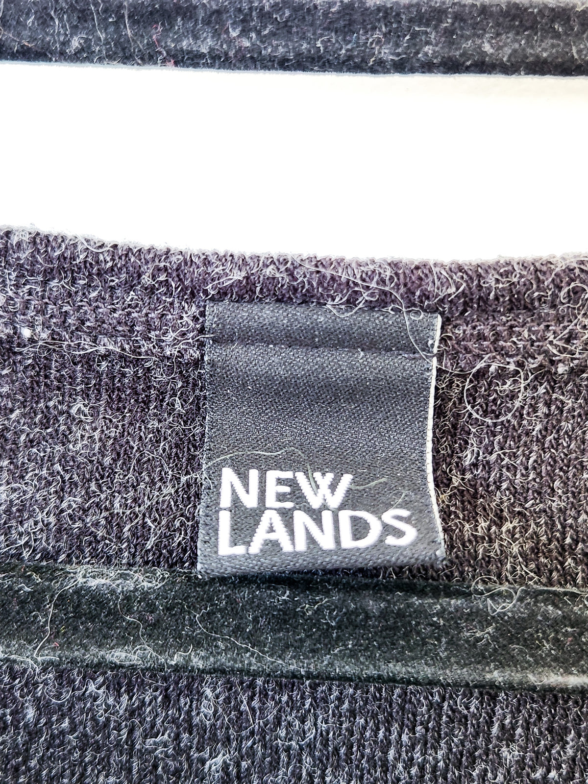 New Lands Slash Neck Top